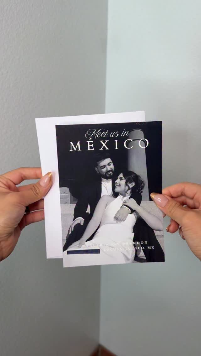 Wedding announcement card for a Mexico destination wedding held by two hands.