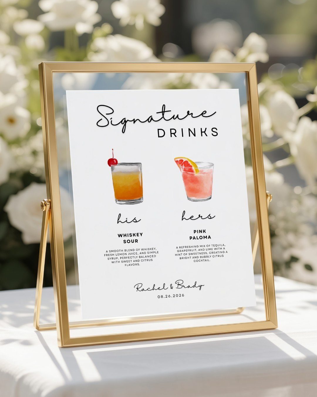 Signature drinks sign in gold frame showing whiskey sour and pink paloma cocktails