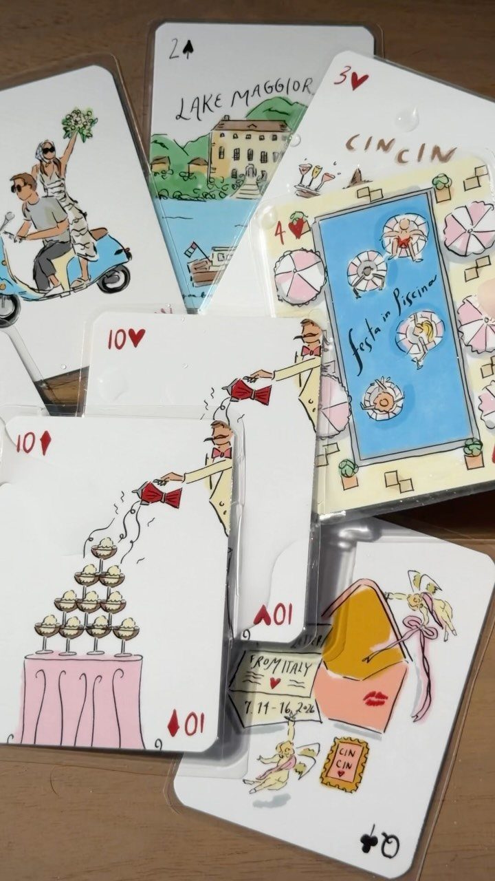 Custom playing cards with romantic illustrations of a couple and Italian scenery.