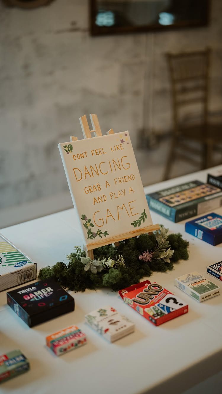 Board games and a sign encouraging guests to play games instead of dancing.